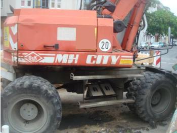 O & K MH City  7650Ah/ Mobilbagger - Wheel excavator