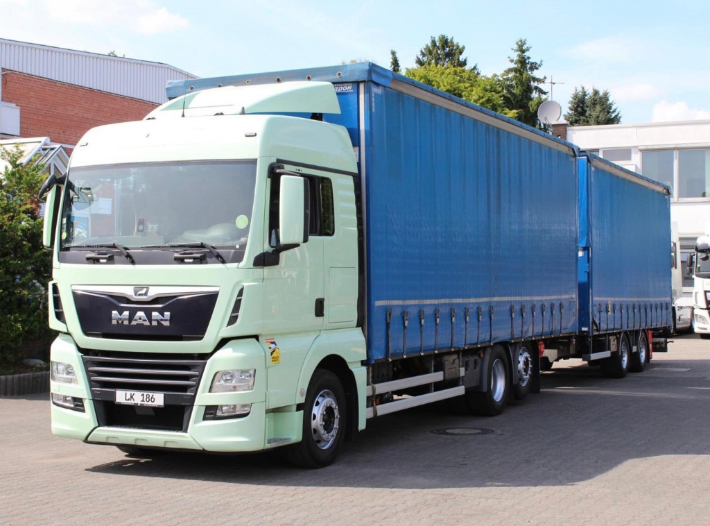 MAN TGX 26.460 Retarder Jumbo-Zug 120M3 Durchlade - Curtain side truck: picture 1 MAN TGX 26.460 Retarder Jumbo-Zug 120M3 Durchlade - Curtain side truck: picture 1