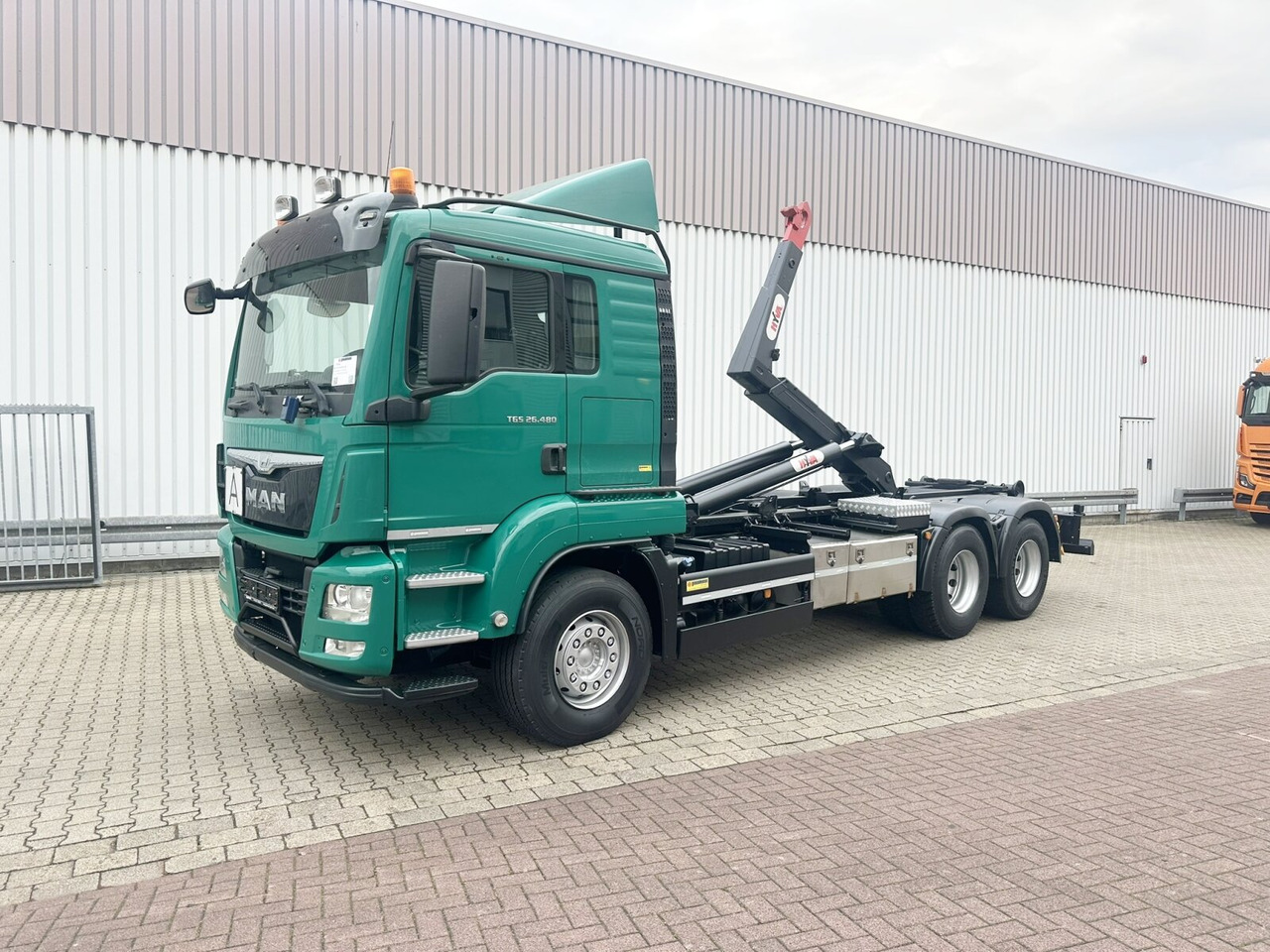 MAN TGS 26.480 6x4 BL TGS 26.480 6x4 BL, Motorabtrieb, Navi, Intarder, Hyva 20.60 S - Hook lift truck: picture 1 MAN TGS 26.480 6x4 BL TGS 26.480 6x4 BL, Motorabtrieb, Navi, Intarder, Hyva 20.60 S - Hook lift truck: picture 1