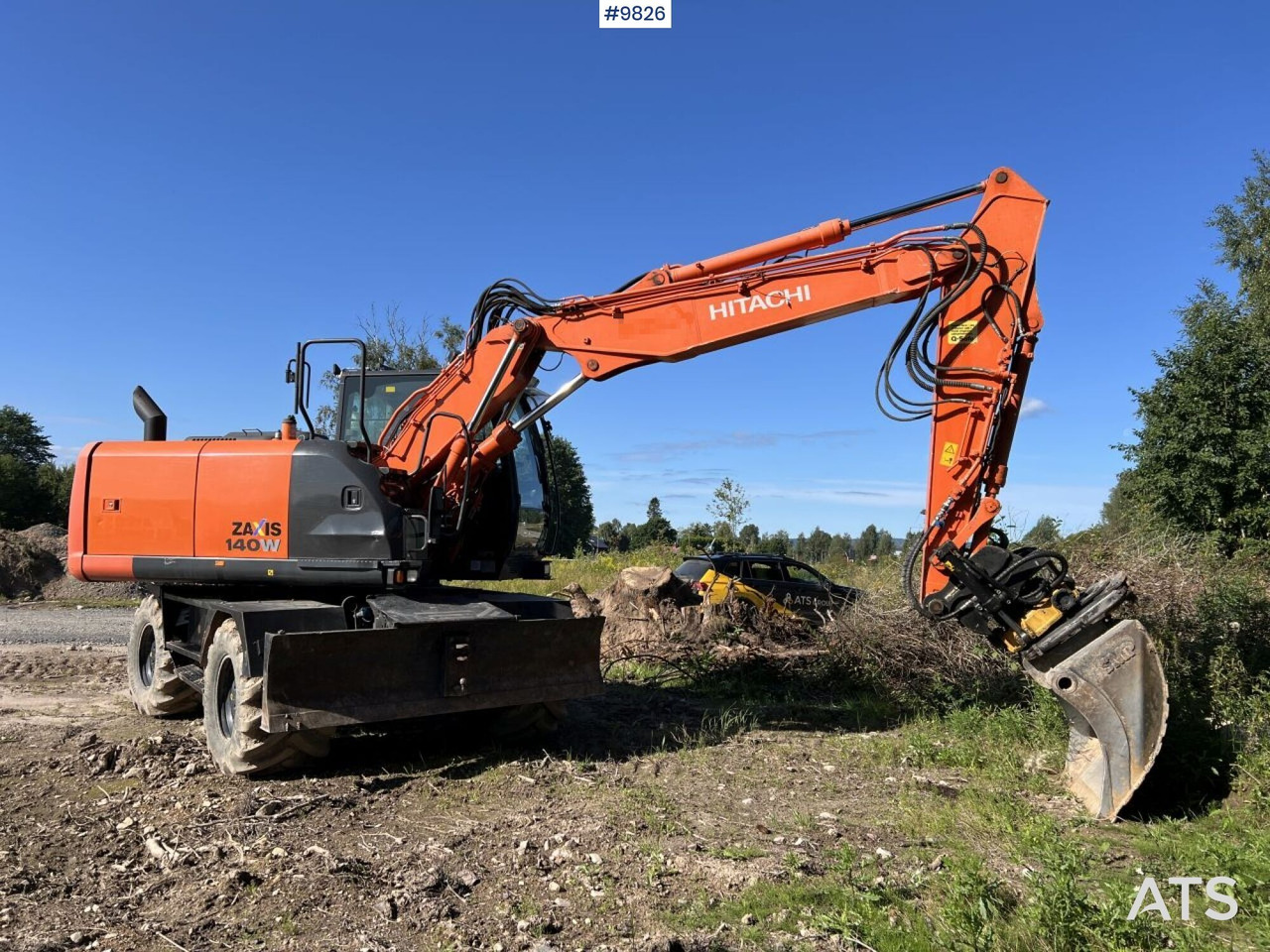 Hitachi ZX140 W-5B with rotor and planer bucket - Wheel excavator: picture 1 Hitachi ZX140 W-5B with rotor and planer bucket - Wheel excavator: picture 1