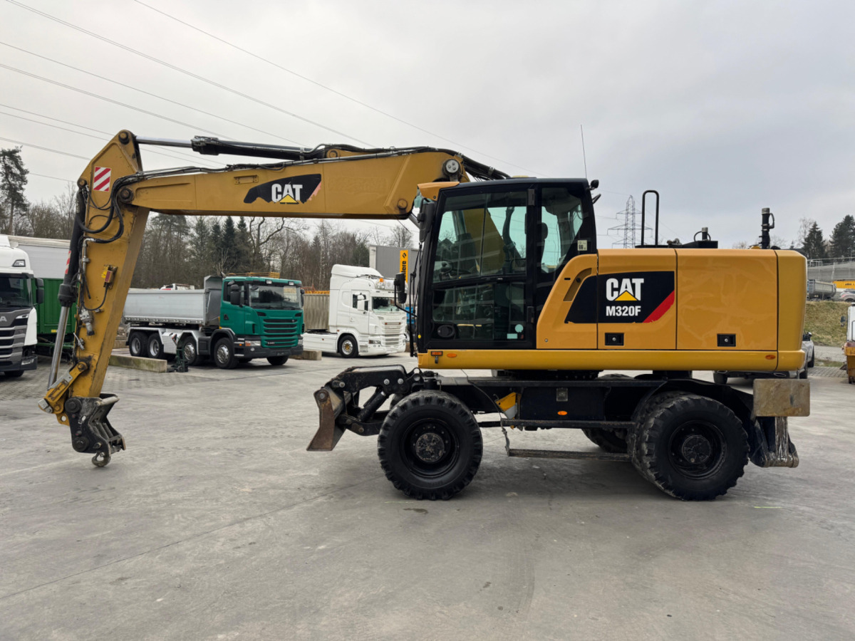Wheel excavator CATERPILLAR M320F Oilquick: picture 7