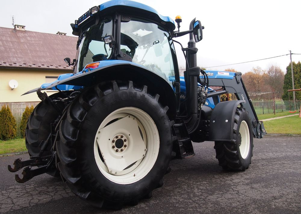 Ciągnik New Holland NH TS125A 6 cylindrów 2004 Ciągnik rolniczy New Holland TS125A - Farm tractor: picture 4 Ciągnik New Holland NH TS125A 6 cylindrów 2004 Ciągnik rolniczy New Holland TS125A - Farm tractor: picture 4