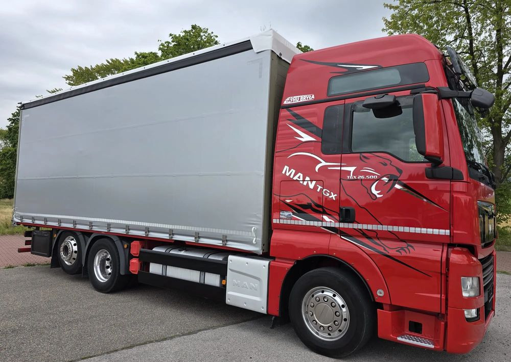 MAN TGX 26.500 / ALUMINIOWE FELGI / LIFT / 6X2 / KLIMA POSTOJOWA / 18PALET / E6 / FIRANKA / 17 TON ŁADOWNOŚĆ / WINDA / NISKI PRZEBIEG / JEDEN WŁAŚCICIEL / PODWIESZANA OŚ - Curtain side truck: picture 1 MAN TGX 26.500 / ALUMINIOWE FELGI / LIFT / 6X2 / KLIMA POSTOJOWA / 18PALET / E6 / FIRANKA / 17 TON ŁADOWNOŚĆ / WINDA / NISKI PRZEBIEG / JEDEN WŁAŚCICIEL / PODWIESZANA OŚ - Curtain side truck: picture 1