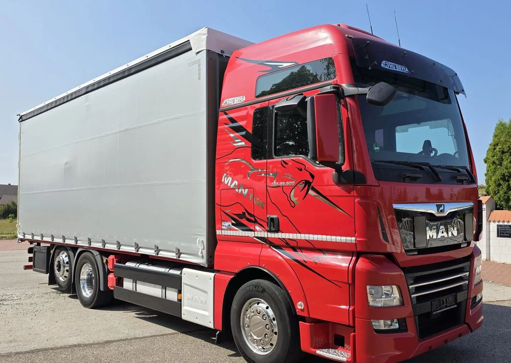 MAN TGX 26.500 / ALUMINIOWE FELGI / LIFT / 6X2 / KLIMA POSTOJOWA / 18PALET / E6 / FIRANKA / 17 TON ŁADOWNOŚĆ / WINDA / NISKI PRZEBIEG / JEDEN WŁAŚCICIEL / PODWIESZANA OŚ - Curtain side truck: picture 2 MAN TGX 26.500 / ALUMINIOWE FELGI / LIFT / 6X2 / KLIMA POSTOJOWA / 18PALET / E6 / FIRANKA / 17 TON ŁADOWNOŚĆ / WINDA / NISKI PRZEBIEG / JEDEN WŁAŚCICIEL / PODWIESZANA OŚ - Curtain side truck: picture 2