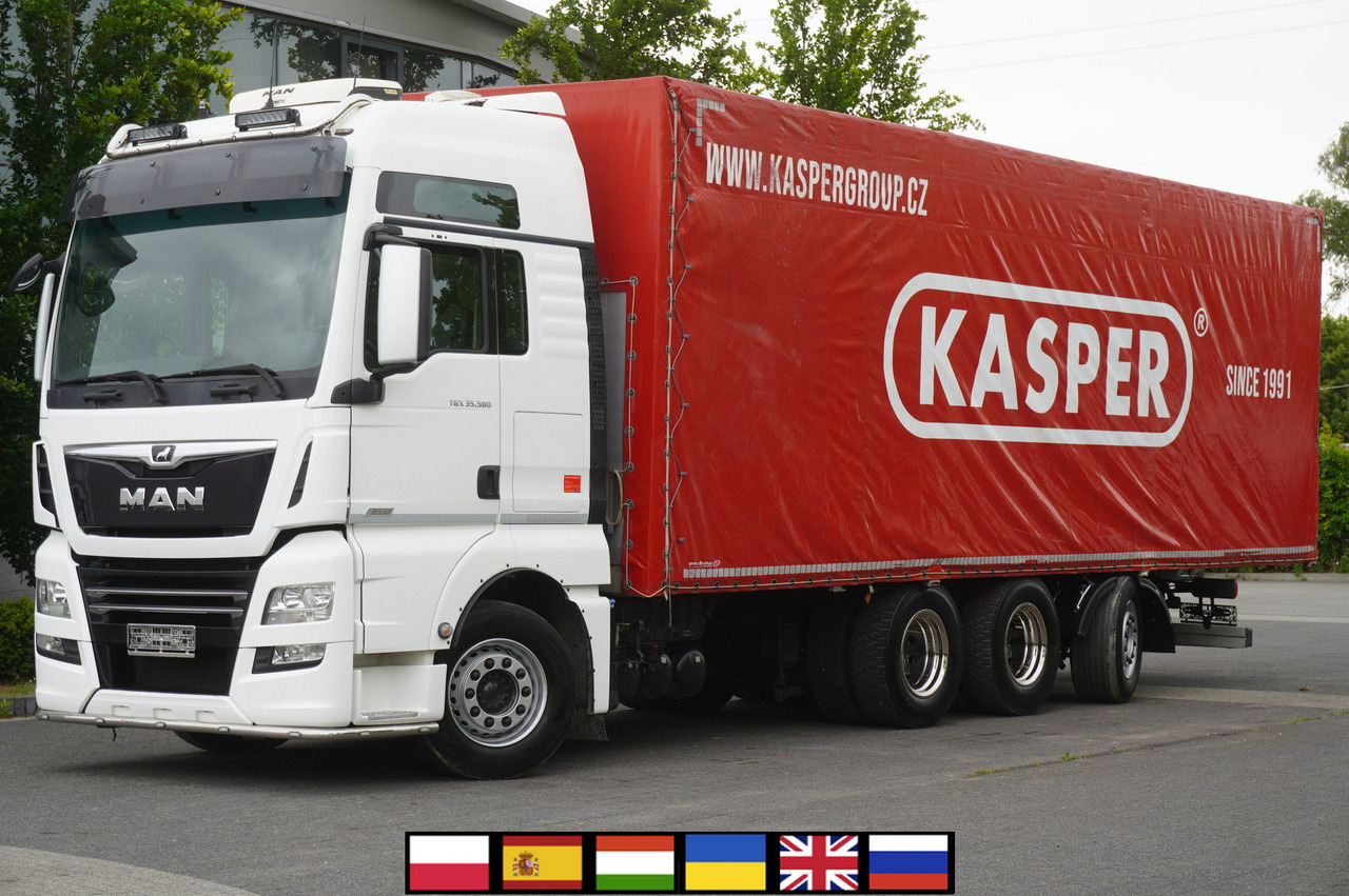 MAN TGX 35.580 E6 8x4 /4 / 23 EPAL tarp superstructure / 4th axle steered - Curtain side truck: picture 1 MAN TGX 35.580 E6 8x4 /4 / 23 EPAL tarp superstructure / 4th axle steered - Curtain side truck: picture 1