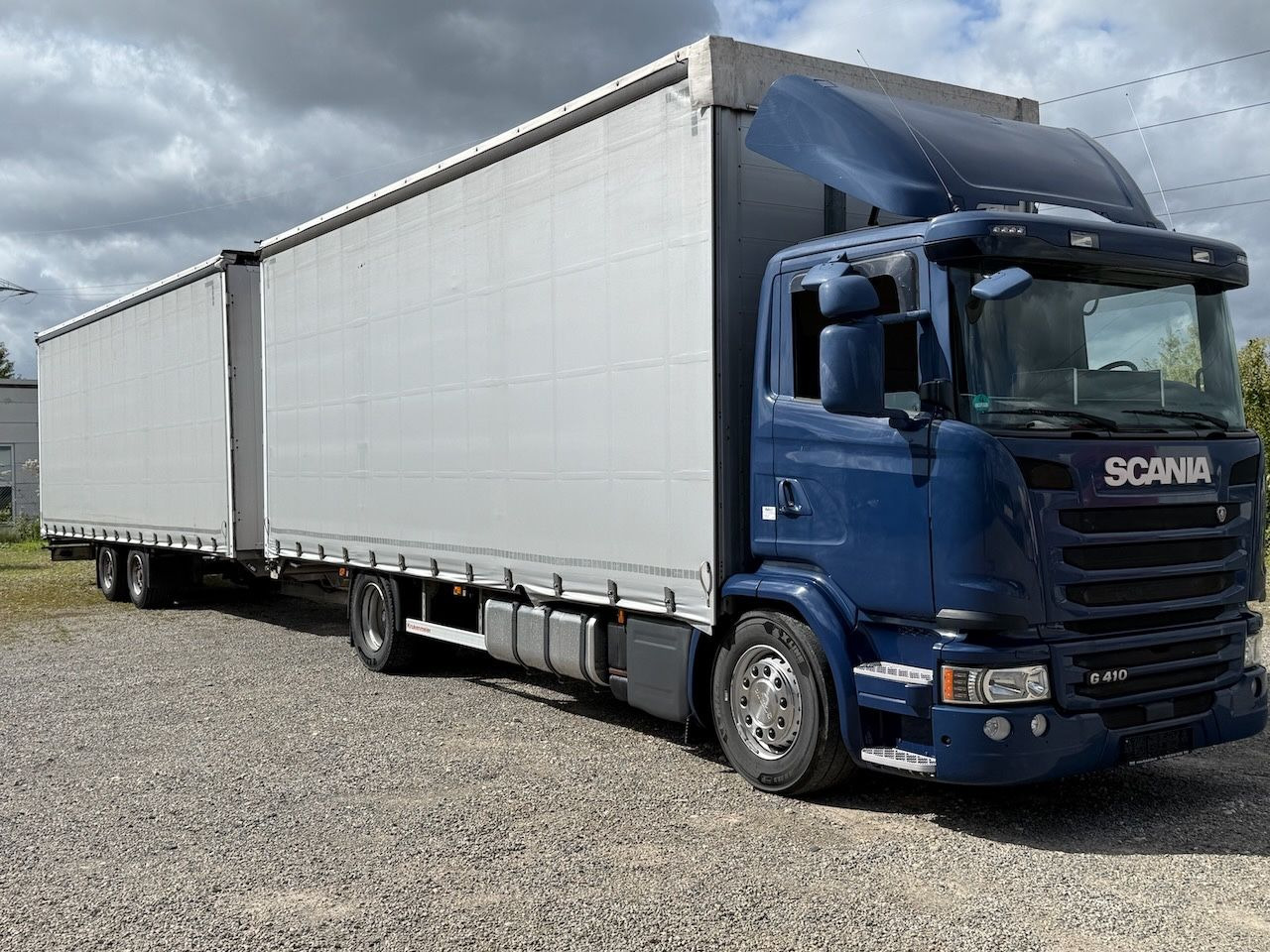 Scania G410 /4x2/ Jumbozug mit durchladbarem Anh. - Curtain side truck: picture 1 Scania G410 /4x2/ Jumbozug mit durchladbarem Anh. - Curtain side truck: picture 1